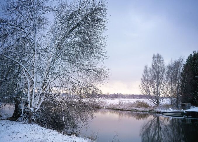 ​Snowy river landscape, Torshälla, Sweden – Photo by Tim Ravenscroft for Wyndlestraw Designs.