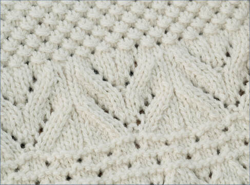 Ocean Currents Blanket worked in cream yarn, by Moira Ravenscroft, Wyndlestraw Designs