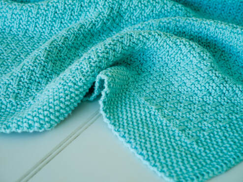 Caela Baby Blanket by Moira Ravenscroft, Wyndlestraw Designs