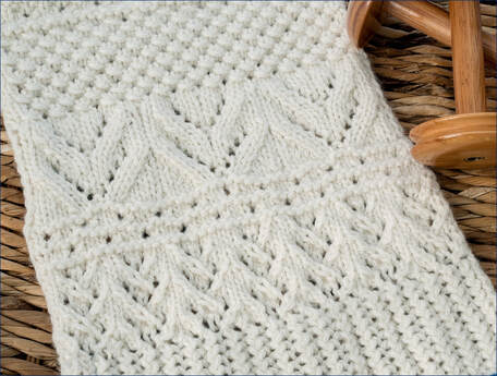Ocean Currents Blanket worked in cream yarn, by Moira Ravenscroft, Wyndlestraw Designs